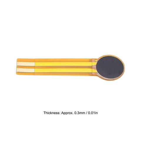 FLEXMAN thin-film pressure sensor on orange flexible substrate with circular dark sensing pad and gold traces