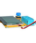 Side view of LCR T4 All In One Handy DIY Friendly Component Tester Kit with 128x64 green backlit LCD and blue buttons.