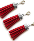 Red tassels with antique silver caps from Flat Leather Cord End Caps Set, 50 Pcs Antique Silver Round Tassel And Barrel End Caps.