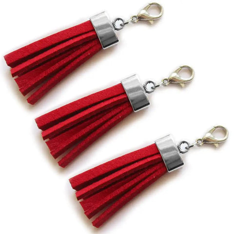 Red tassels with antique silver caps from Flat Leather Cord End Caps Set, 50 Pcs Antique Silver Round Tassel And Barrel End Caps.