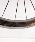 Close-up of Carbon Fiber 700C Road Bike Wheel Set With 50mm Clincher Rim, showing the sleek carbon material and spoke design.