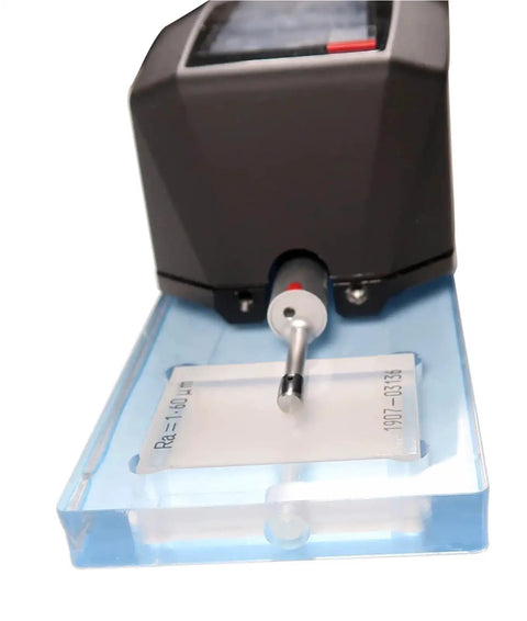 Portable TMR200 Surface Roughness Gauge With DSP Processing, handheld tester on blue base with probe and OLED display