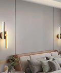 Super Slick Retro LED Wall Sconce With Full Copper Metal Base And Frosted Acrylic Shade, wall-mounted beside bed for ambient lighting.