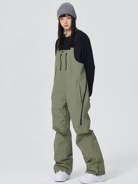 Model wearing army green Waterproof Ski Bibs Men Winter Snow Pants Overalls Snowboarding Outdoor Sports Breathable High Stretch
