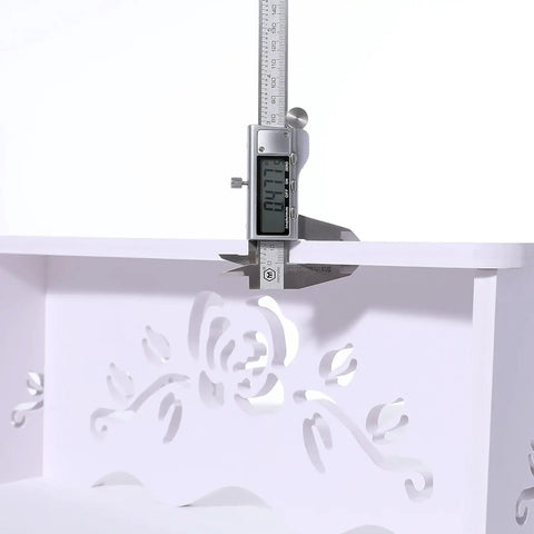 Close-up of a white 7 Inch Squat Toilet Stool For Bathroom Made From Wood Plastic Composite, showing thickness measurement with caliper.