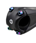 Close-up of bike stem with rainbow titanium bike stem bolts
