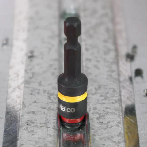 Two In One 2 Inch Impact Grade Nut Driver With Quick Change Reversible Magnetic Hex on metal surface