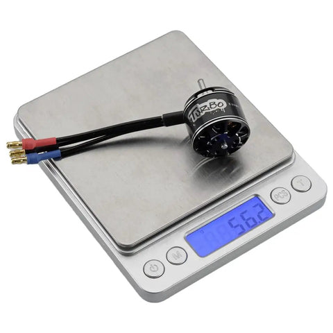 D2826EVO 2200KV Beefy Brushless RC Motor weighing on digital scale, showing 56.2 grams, for UAV drones and RC planes