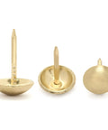 Upgrade Your Furniture Game With These Top Shelf Gold Upholstery Tacks 300 Piece Kit featuring three gold tacks with round heads.