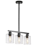 Sleek Black Three Light Kitchen Island Pendant Lamps Using Dimmable E26 Base hanging over countertop with clear glass shades.