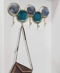 Wall Mounted Coat Rack With Heavy Duty Iron Hooks For Entryway Or Bathroom Door Organizer, features 5 decorative hooks holding a bag.