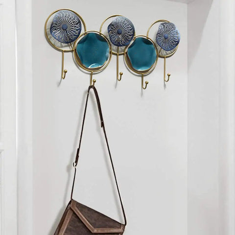 Wall Mounted Coat Rack With Heavy Duty Iron Hooks For Entryway Or Bathroom Door Organizer, features 5 decorative hooks holding a bag.