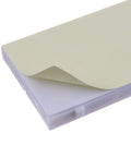 Close-up of Plug And Play Solderless Breadboard Kit surface with adhesive layer partially peeled, showing board material.