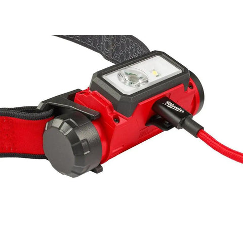 RedLithium USB Hard Hat Headlamp With LED Power 2163-21 Includes One Battery And One Charger USB Rechargeable Safety Lighting. Close-up view with charging cable.