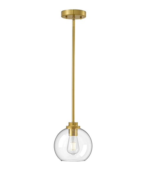 Brass and glass pendant light on white background with visible bulb, modern design