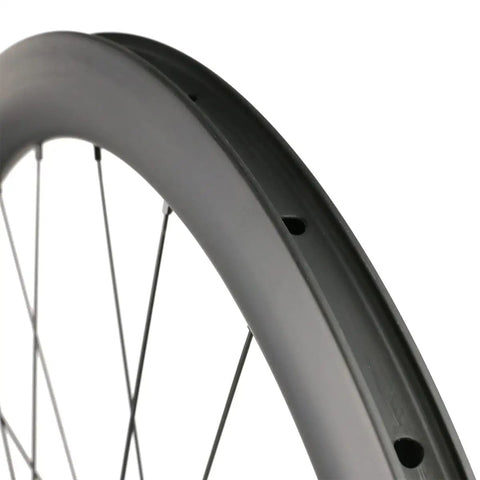 Close-up of Beefy Carbon Wheelset 700C Disc Brakes 45mm Tubeless Ready Clincher showing Toray T700 Rim with 24 Hole Hub