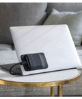 On The Go Portable SSD Sleeve For Laptop With Reusable Adhesive Grab And Go External Drive Carrying Case Pocket Pouch Small Black attached to laptop.