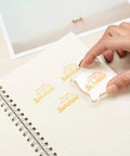 12 Piece Clear Acrylic Stamp Block Set With Assorted Sizes For Scrapbooking And Card Making, Transparent Mounting Blocks With Grid Lines For Precise Alignment, Must Have For Crafts Stamping Projects And DIY Cards. Clear acrylic stamp block on dotted notebook paper, hand stamping