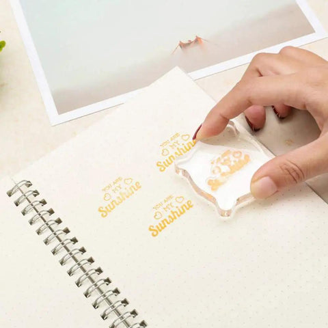12 Piece Clear Acrylic Stamp Block Set With Assorted Sizes For Scrapbooking And Card Making, Transparent Mounting Blocks With Grid Lines For Precise Alignment, Must Have For Crafts Stamping Projects And DIY Cards. Clear acrylic stamp block on dotted notebook paper, hand stamping