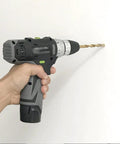 Person using Badass Rechargeable Two-Speed Drill and Screwdriver Combo with 10mm Chuck for drilling into wall.