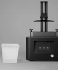 Filament Storage Box For 3D Printer With Drying System And Airtight Waterproof Seal 5.8L Capacity next to a 3D printer machine.