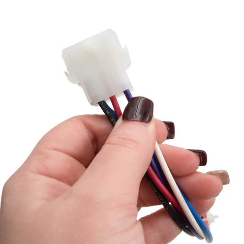 Close-up of hand holding connector with wires from 8 kW 208 240 Volt Single Phase Heating Element Beefy Kit For Air Handlers