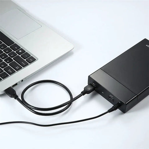 Hella Fast Plug And Play Sata Iii To Usb 3.0 External Hard Drive Enclosure connected to a laptop with USB cable.