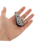 Heavy Duty Marine Pulley Blocks Four Pack With Stainless Steel Bearings for kayak hoist, shown in hand for size reference.