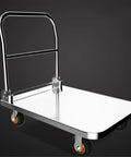 Heavy Duty Stainless Steel Platform Hand Truck Hella Durable Push Cart With Six Inch Swivel Wheels and Reliable Locking Brakes, side view.