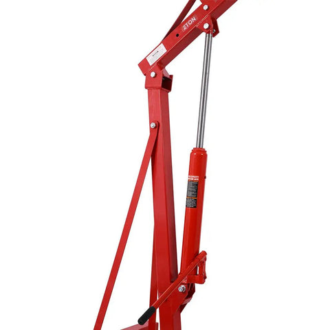 Heavy Duty Two Ton Hydraulic Engine Hoist And Foldable Cherry Picker Shop Crane With Roll Around Caster Wheels Rust Resistant Steel Lifter close-up of hydraulic mechanism.
