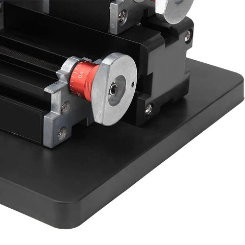 Close-up view of Garosa Mini Metal Lathe With 60 Watt Motor And 12000 RPM Speed dials and components for precision machining.