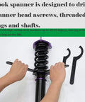 C Hook Wrench For 28-32mm Round Nut Metric Collet Chuck in use on spanner head with threaded rings, hands holding tools