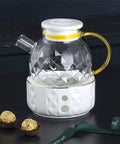 800 Ml Portable Electric Kettle For Car And Truck Rides Quick Boil Vacuum Insulated Water Heater Maintains Temperature All Day Long Keeps Your Daily Grind Piping Hot On The Way with transparent glass body and white base.