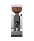 Silent conical burr grinder featuring a sleek design with a transparent bean hopper. Level Up Your Home Barista Setup With This Sleek Copper And Chrome Espresso Machine Paired With A Silent Conical Burr Grinder In A Complete Bundle Crafted For Smooth Extractions And Effortless Daily Coffee Vibes.