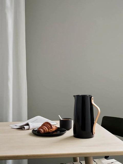 Emma Insulated Coffee Flask 1.2 Liter With Beechwood Handle on table with croissant and coffee, modern style