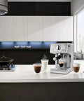 Silver 15 Bar Espresso Coffee Machine With Adjustable Brewing Controls For Homemade Cappuccinos And Lattes on a kitchen counter with cups.