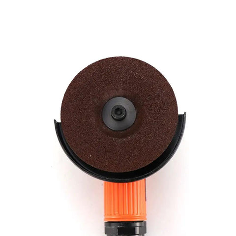 Badass 4 Inch Pneumatic Angle Grinder For Heavy Duty Polishing And Grinding Featuring Front Exhaust Cooling Adjustable Speed Switch And Rugged Metal Spark Guard Cover, top view showing grinding disc.