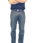 Man standing on heavy duty air mover and carpet dryer with three quarter HP motor delivers 2800 CFM and durable housing.