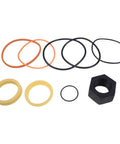 Image of Tilt Hydraulic Cylinder Seal Kit 7135551 with various seals and a nut for Bobcat Skid Steer Loaders models 630 to 753