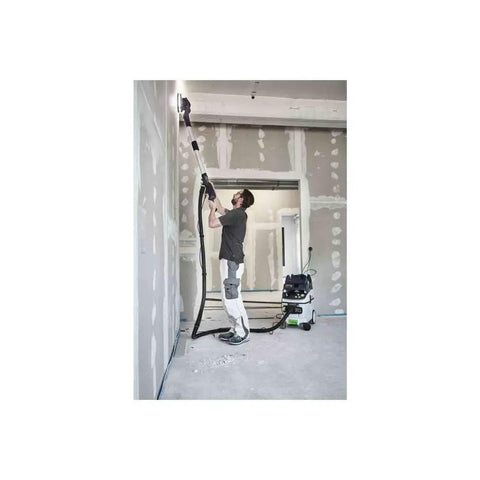 Worker using PLANEX LHS 2 225 EQI Plus Drywall Sander With LED Ring Light on ceiling, showing adjustable suction and dust control.
