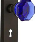 New York Plate With Keyhole Passage Doorknob Set featuring Waldorf cobalt crystal knobs in oil-rubbed bronze, 2-3/4 backset