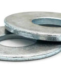 Two Top Tier Zinc Coated Flat Washers crafted to spread load and stop metal fatigue, showcasing broad support base.