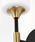 Close-up of Industrial Mid Century Wall Sconce Set Of 2 With White Cylinder Glass Shades For Modern Bathroom Vanity In Matte Black And Brushed Brass Finish