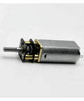 Premium DC Gear Motor With Smooth Low Rpm Reduction And Full Metal Housing Built Like A Tank For Robotics Mods Smart Car Builds And Diy Projects That Truly Deliver The Goods, showing metal housing and gear.