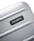 Samsonite luggage front close-up; Artic Silver polycarbonate hardside with brand badge