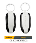 Show Off Your Tesla Model X Whip With This Dope Silicone Key Fob Cover In Clean White Featuring Crack And Scratch Shield And Reliable Clasp Keychain To Keep Your Essential Keys Legit Safe, showing white and black silicone key fob cover.