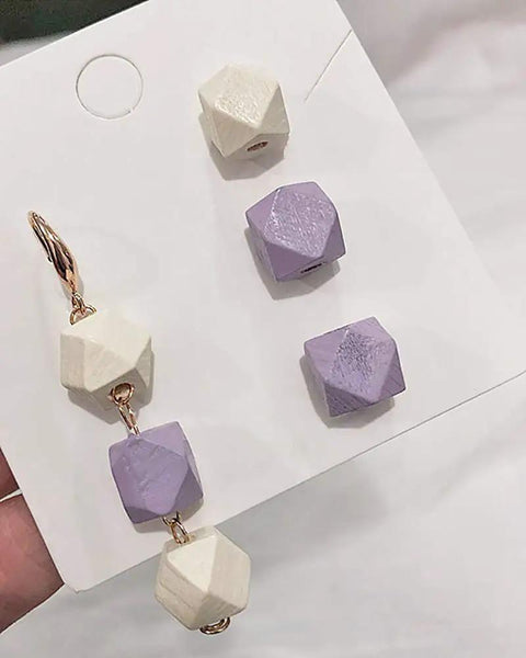 Unpainted Faceted Geometric Wood Beads 16mm With 3.5mm Holes Natural Color For DIY Jewelry Making 100 Pieces Dope For Necklaces Keychains And Crafts Assortment, featuring a mix of purple and natural wood beads.