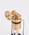 Close-up of Retro Three Legged Oscillating Steam Engine Model Kit with brass gear details and piston action.
