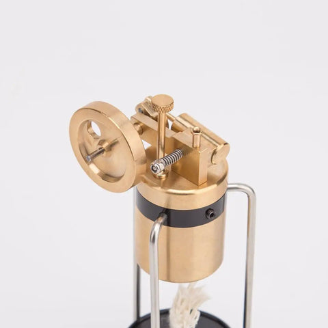 Close-up of Retro Three Legged Oscillating Steam Engine Model Kit with brass gear details and piston action.