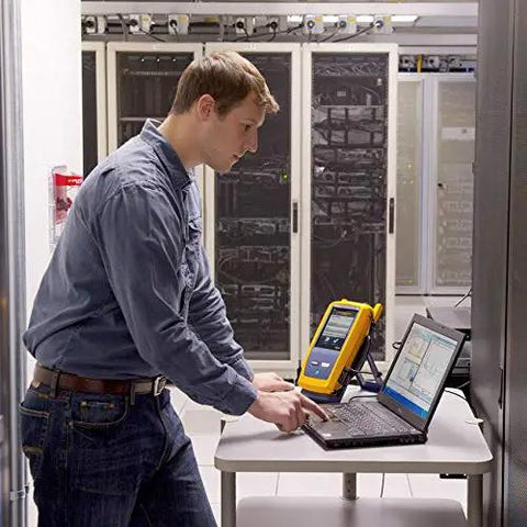 Technician using Slick Fiber Optics Testing Kit Hella Versatile With Quad OTDR And OLTS Modules For LAN Datacenter PON FTTX Setup.